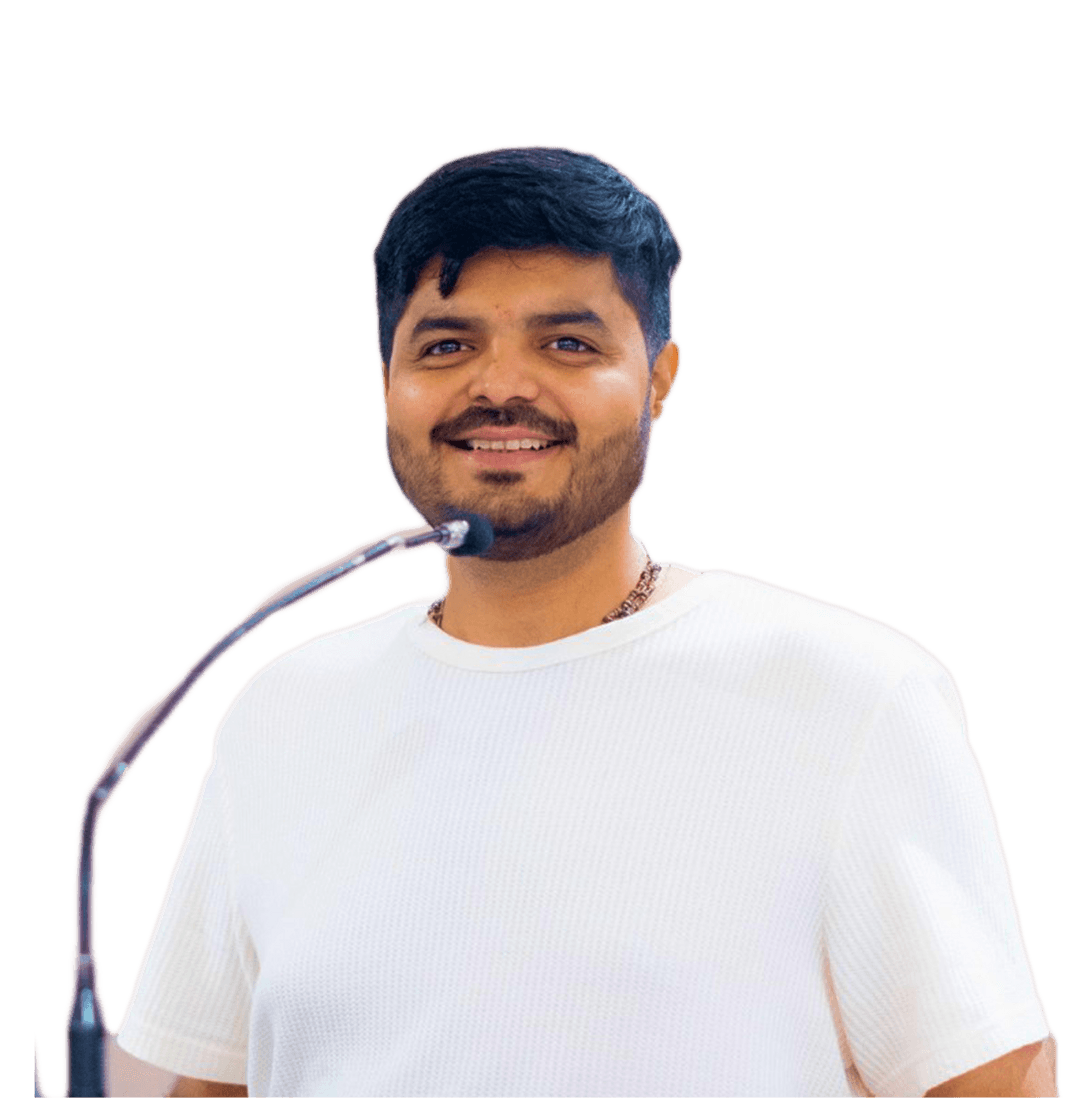 Parth Verma speaking at a microphone